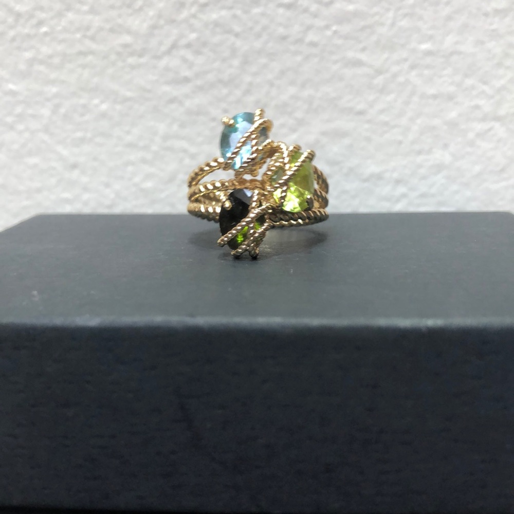 Gold ring with multiple stone accents.